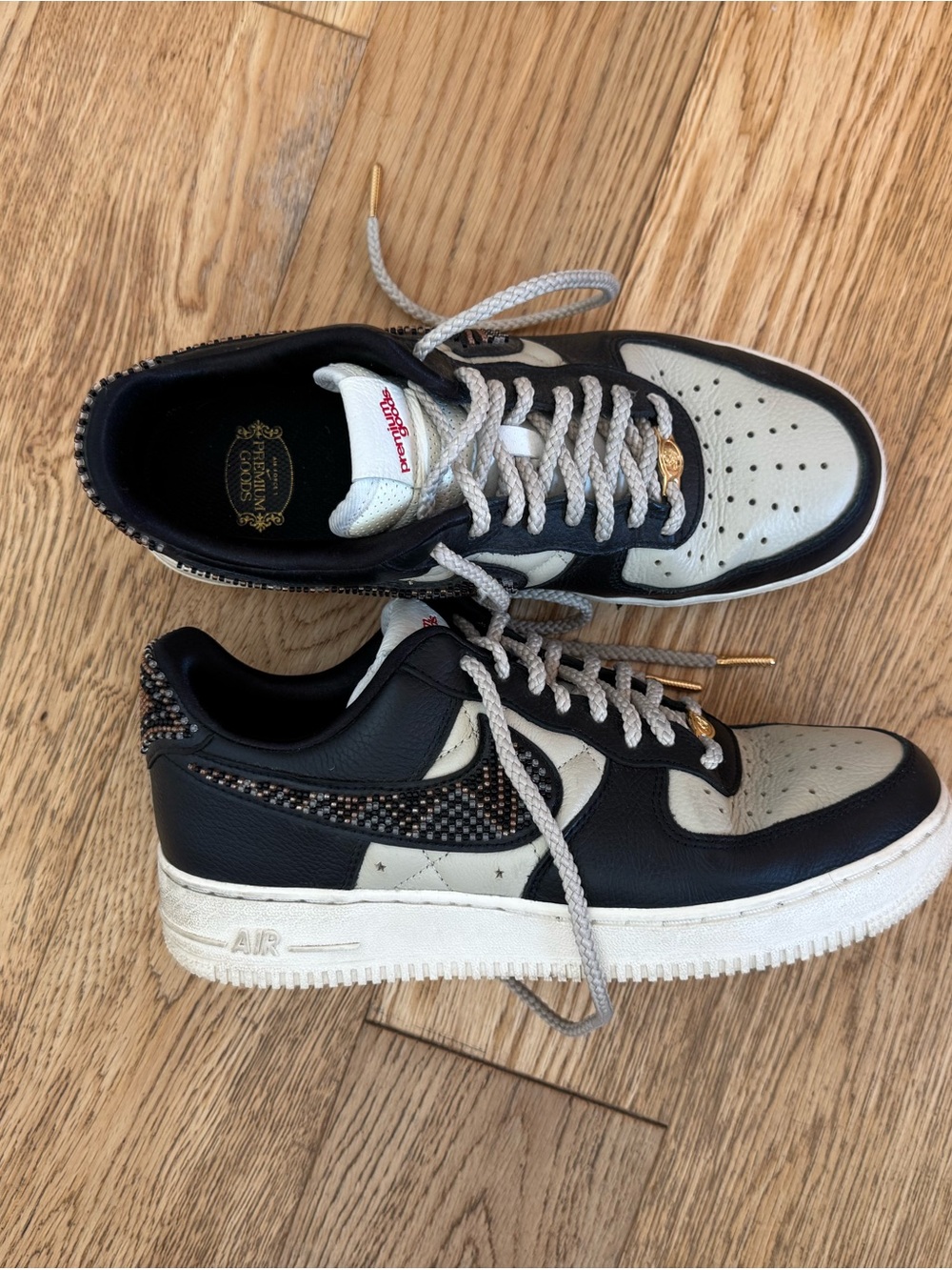 Nike Black and Cream Low-Top Sneakers with Patterned Swoosh